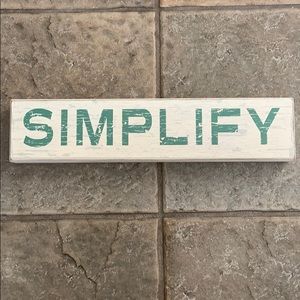 “SIMPLIFY” box sign